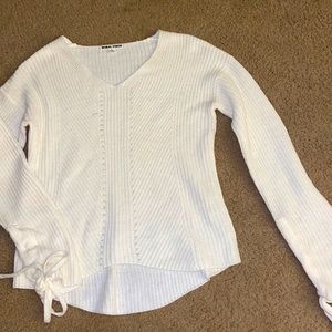 Large white sweater fits more like medium